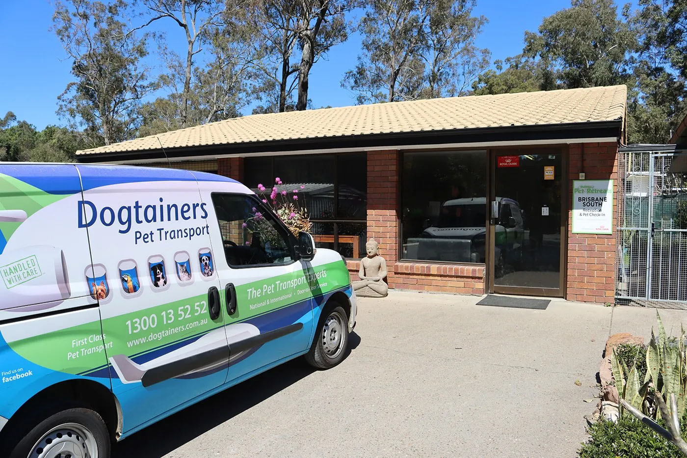 A Dogtainers Pet Transport van parked outside the Dolittles Brisbane South Cattery.
